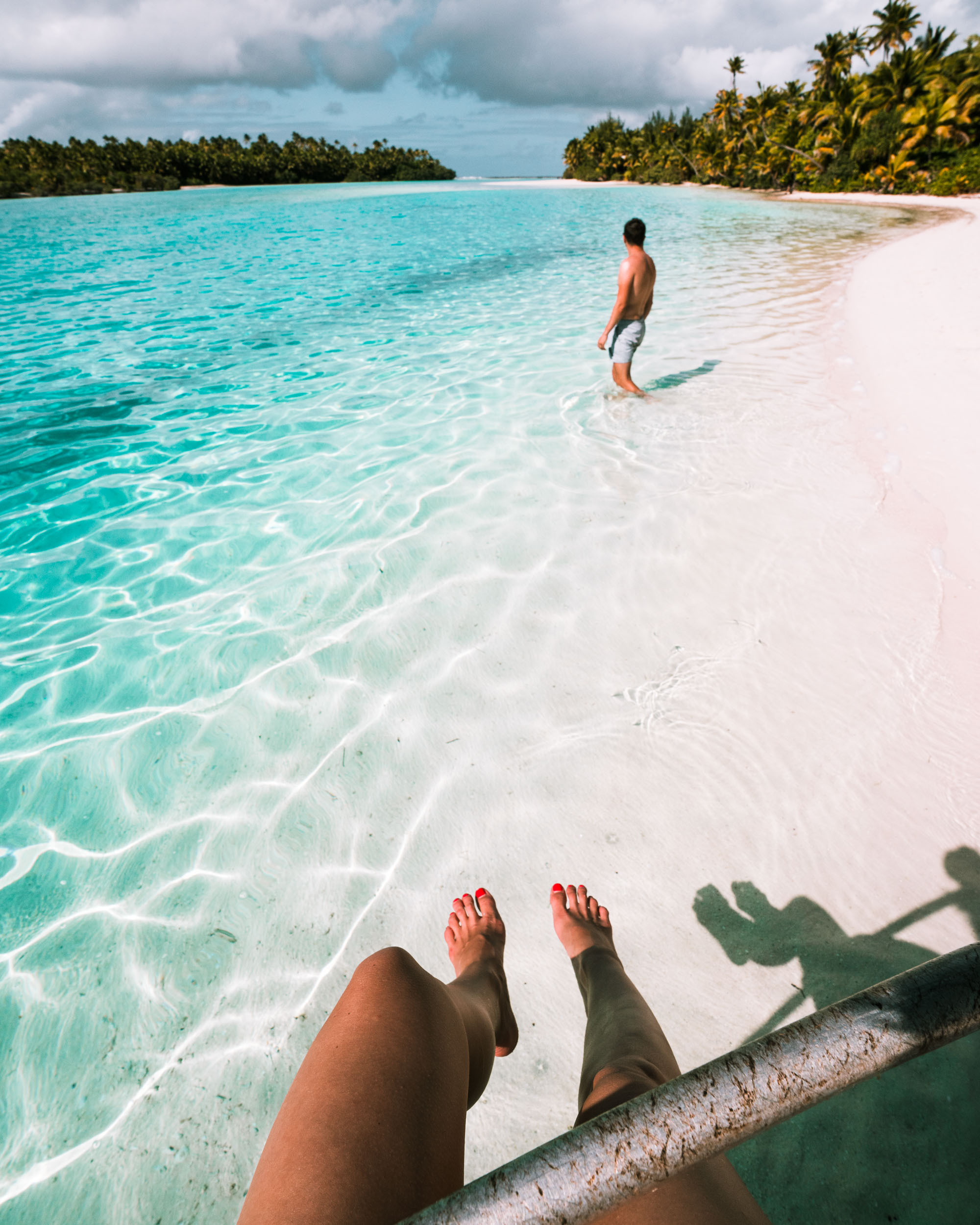 Couple travel bloggers Selena and Jacob Taylor of Find Us Lost at One Foot Island in the Cook Islands