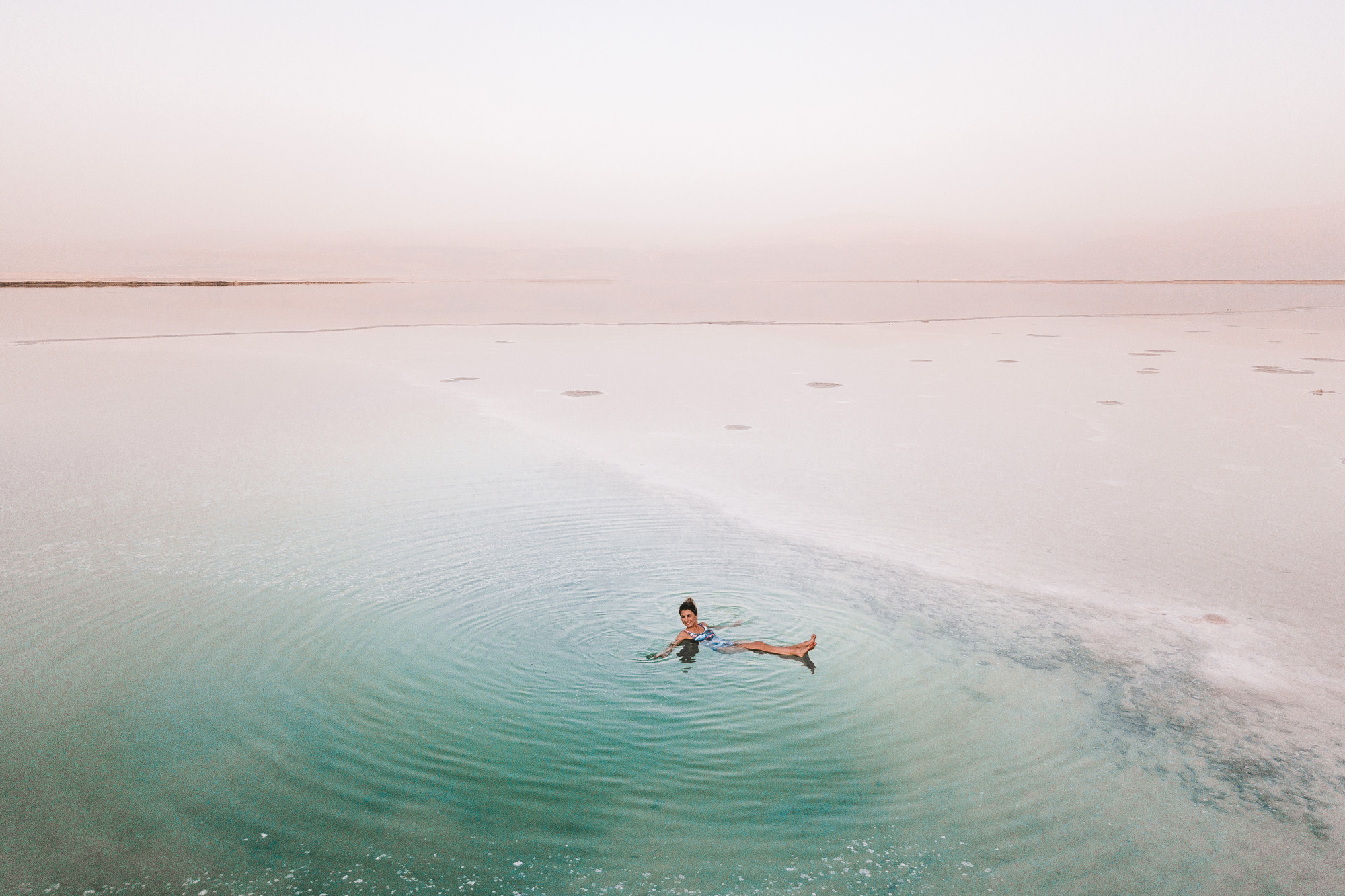 Floating in the dead sea during dusk israel find us lost