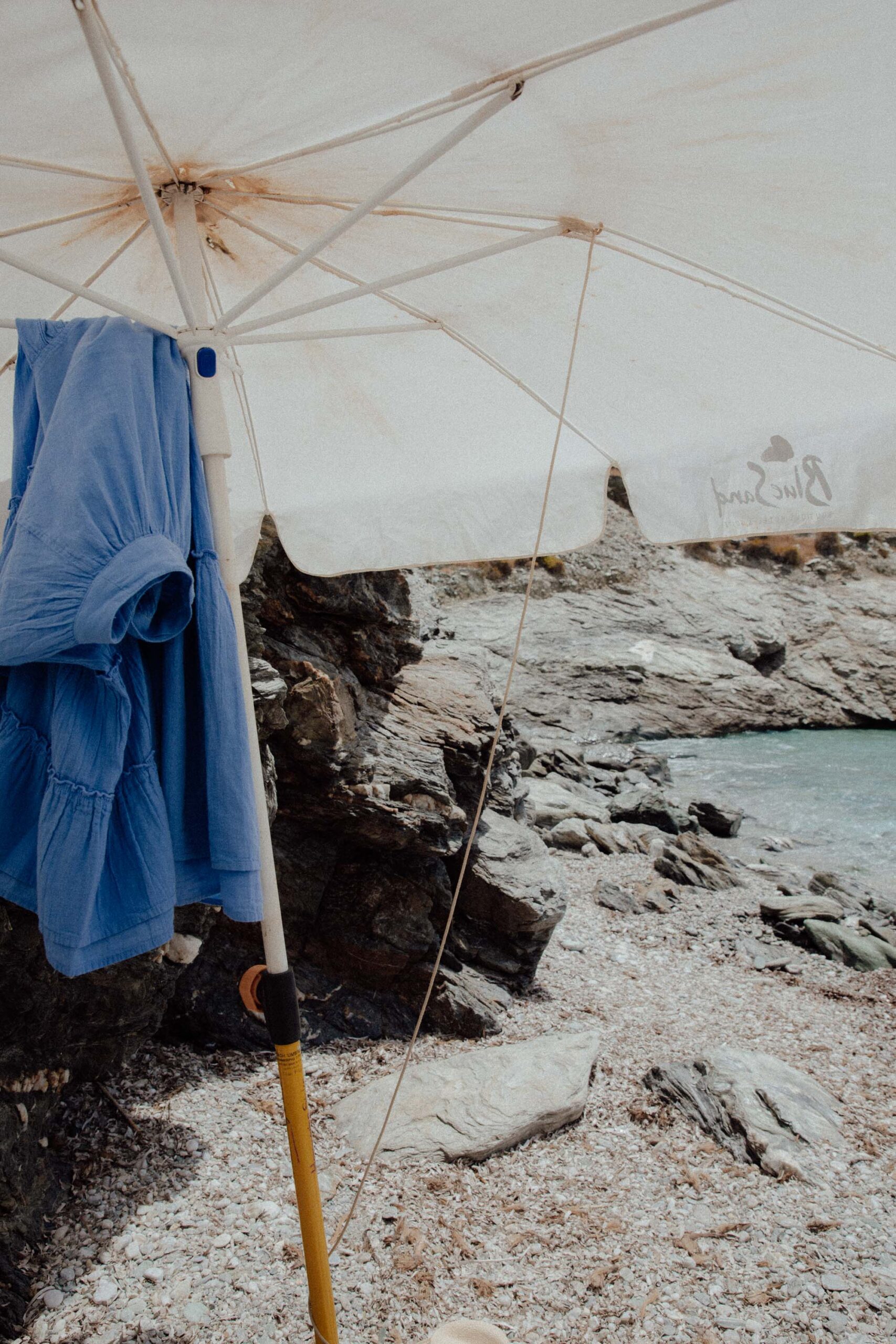 Remote Paralia Ampeli Beach Folegandros with white pebbles, emerald waters and undeveloped shoreline