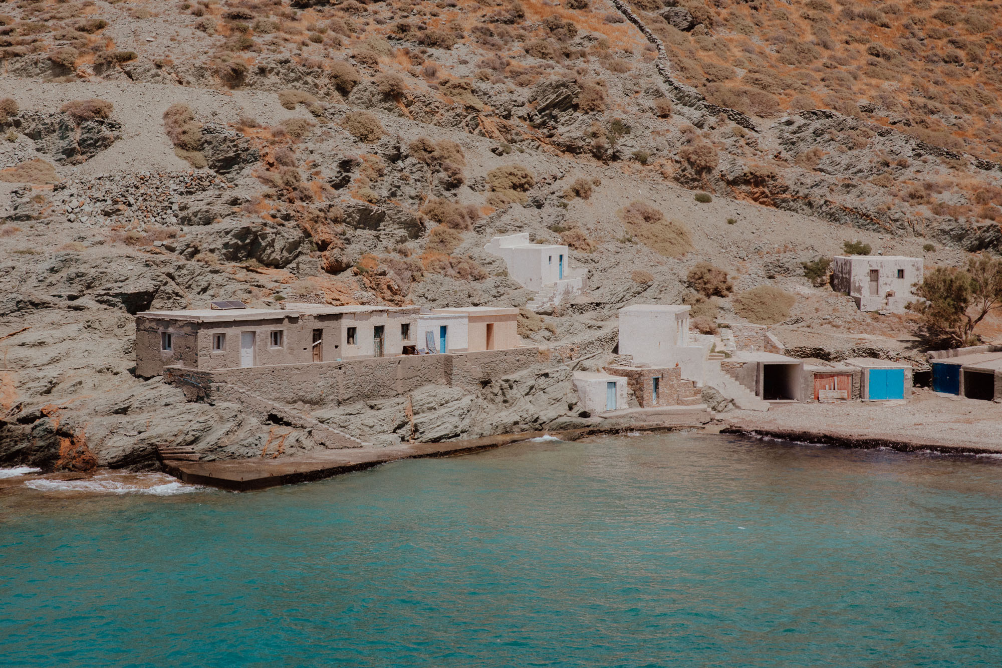 Unspoiled Agios Georgios Beach Folegandros with natural landscape, crystal waters and peaceful setting