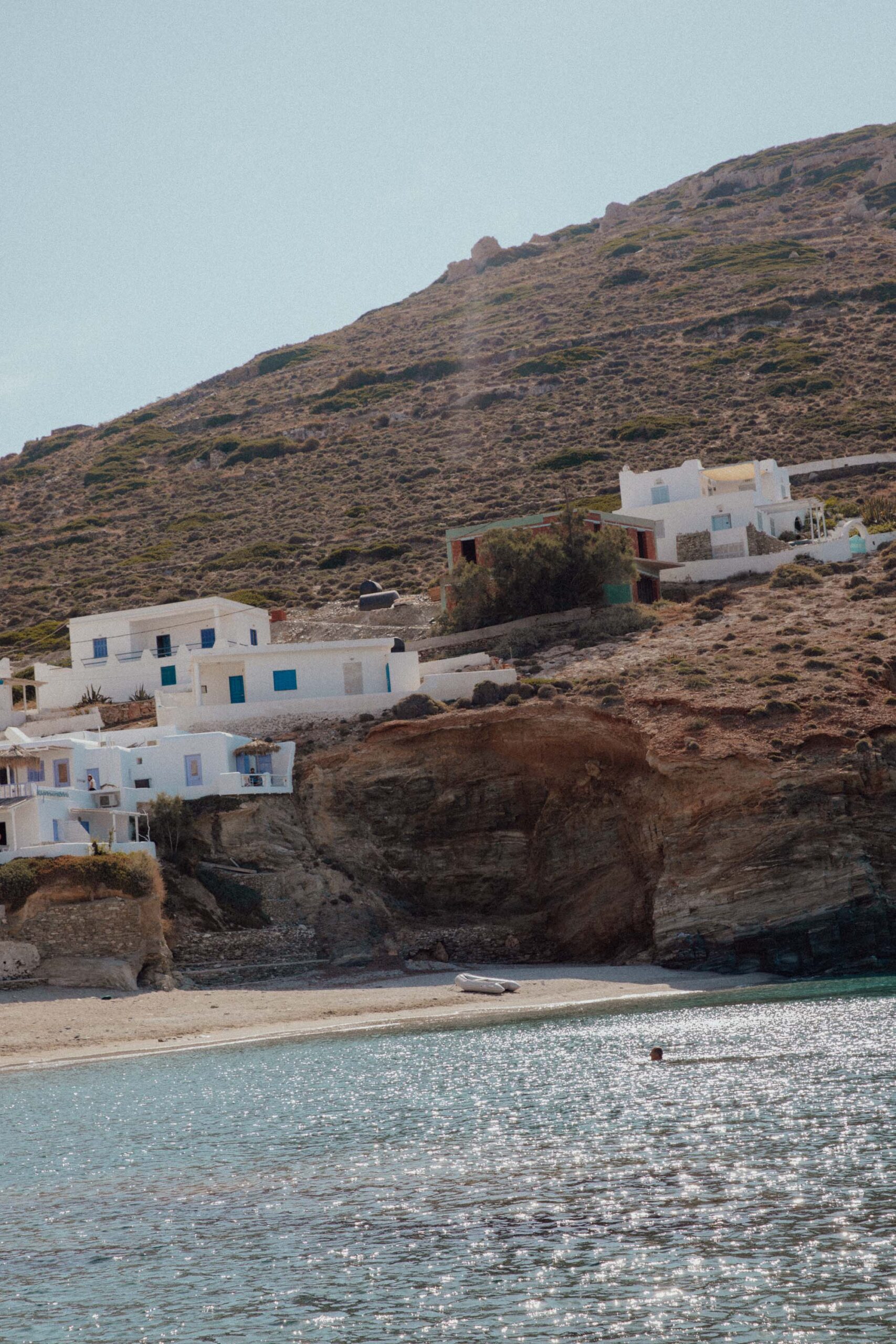 Paralia Agali Beach Folegandros with crystal waters, pebbled shore and whitewashed stone houses