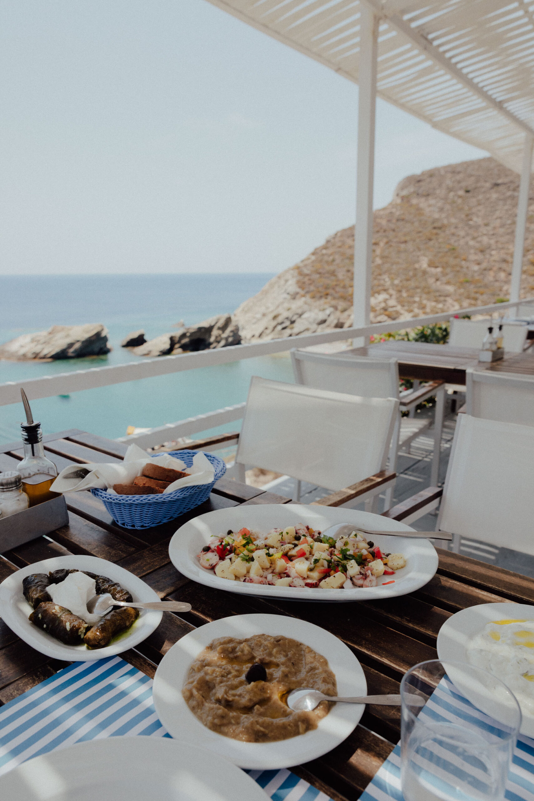 Fresh seafood spread at Papagali Restaurant Folegandros with Greek meze, grilled octopus, and traditional Cycladic dishes"