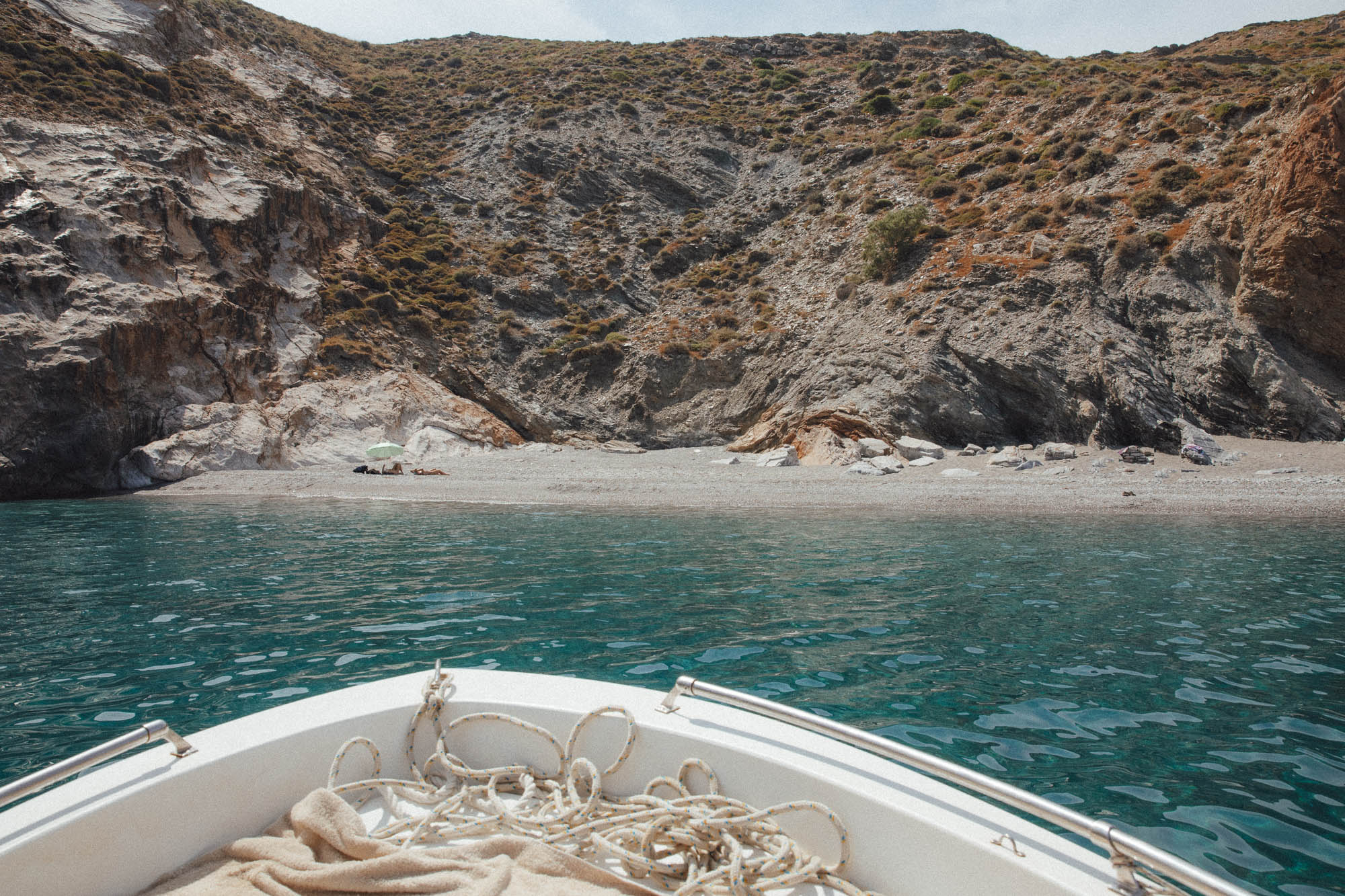 Wild Katergo Beach Folegandros by boat with dramatic cliffs, pristine sands and transparent turquoise waters