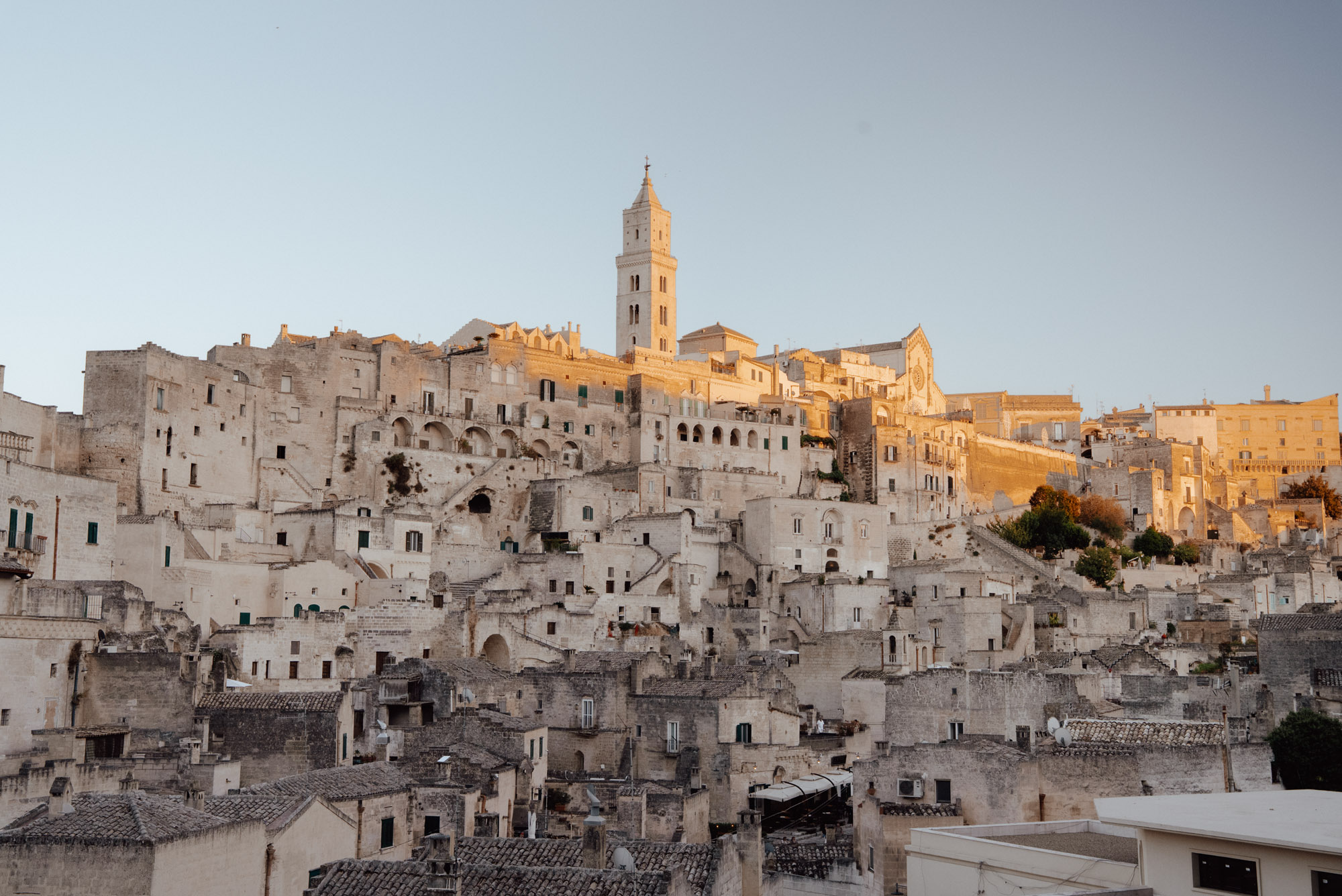 Golden hour sunset over Matera Italy ancient Sassi cave dwellings and stone buildings