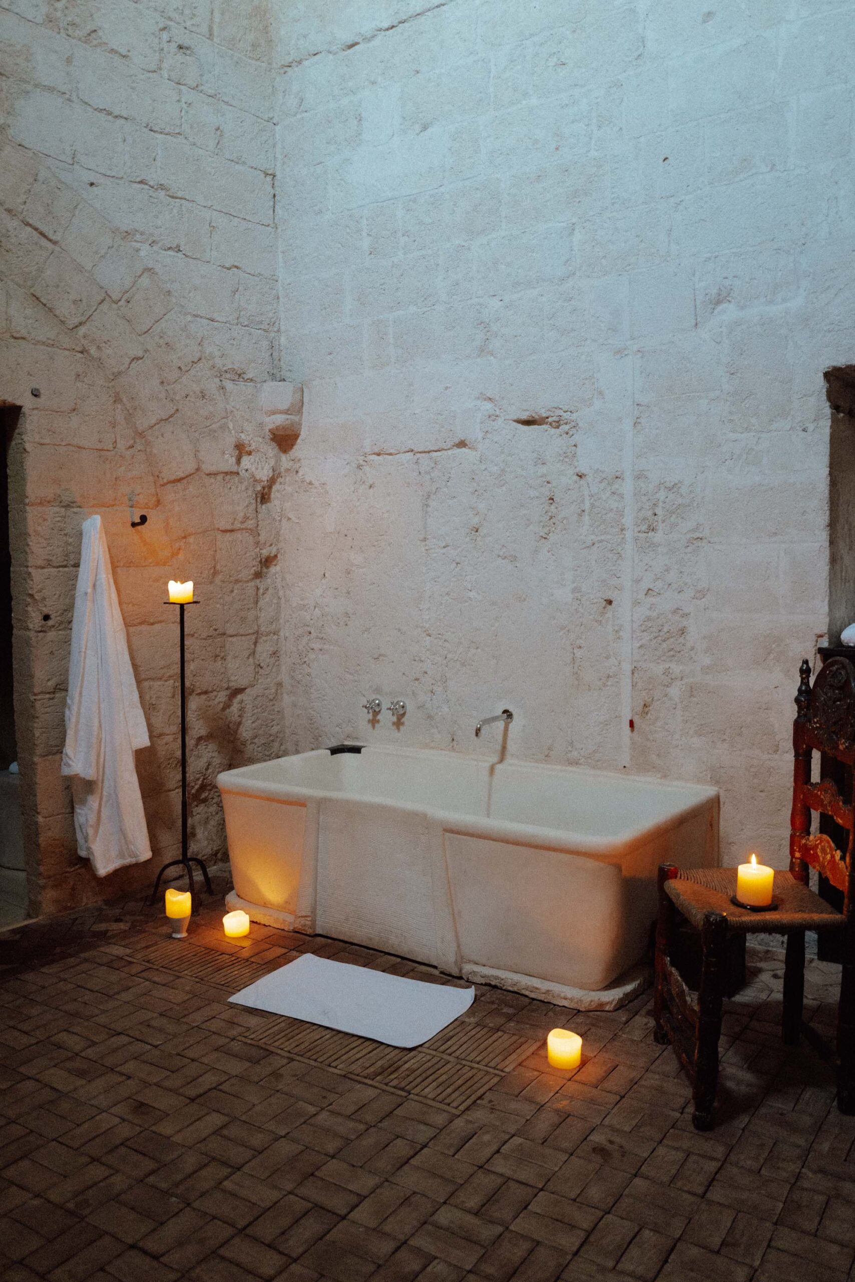 romantic candlelit rooms and a tub at sextantio le grotte della civita the original cave hotel in matera italy