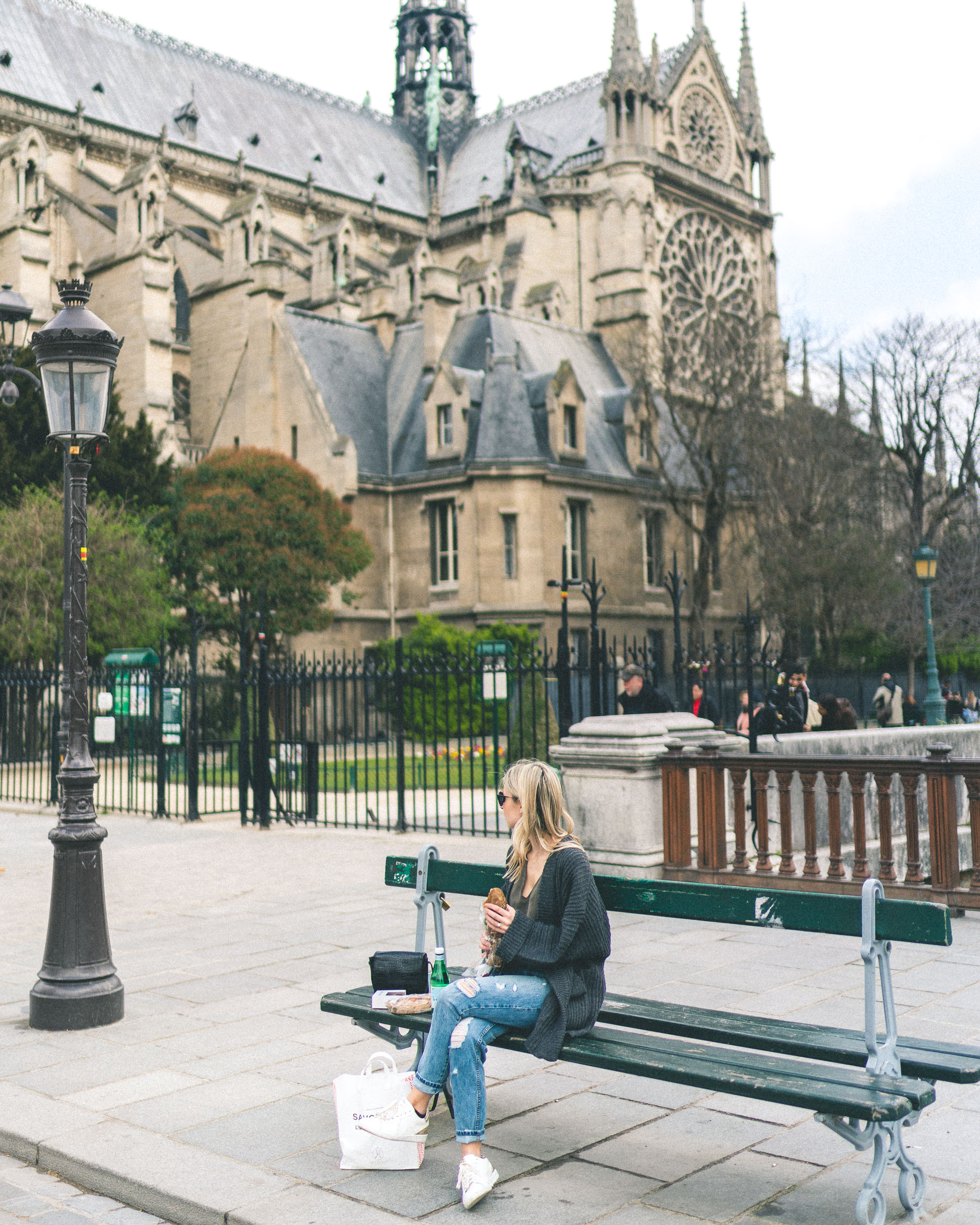 Best parisian bakeries to go - Notre Dame de Paris bench - Complete Paris Travel Guide