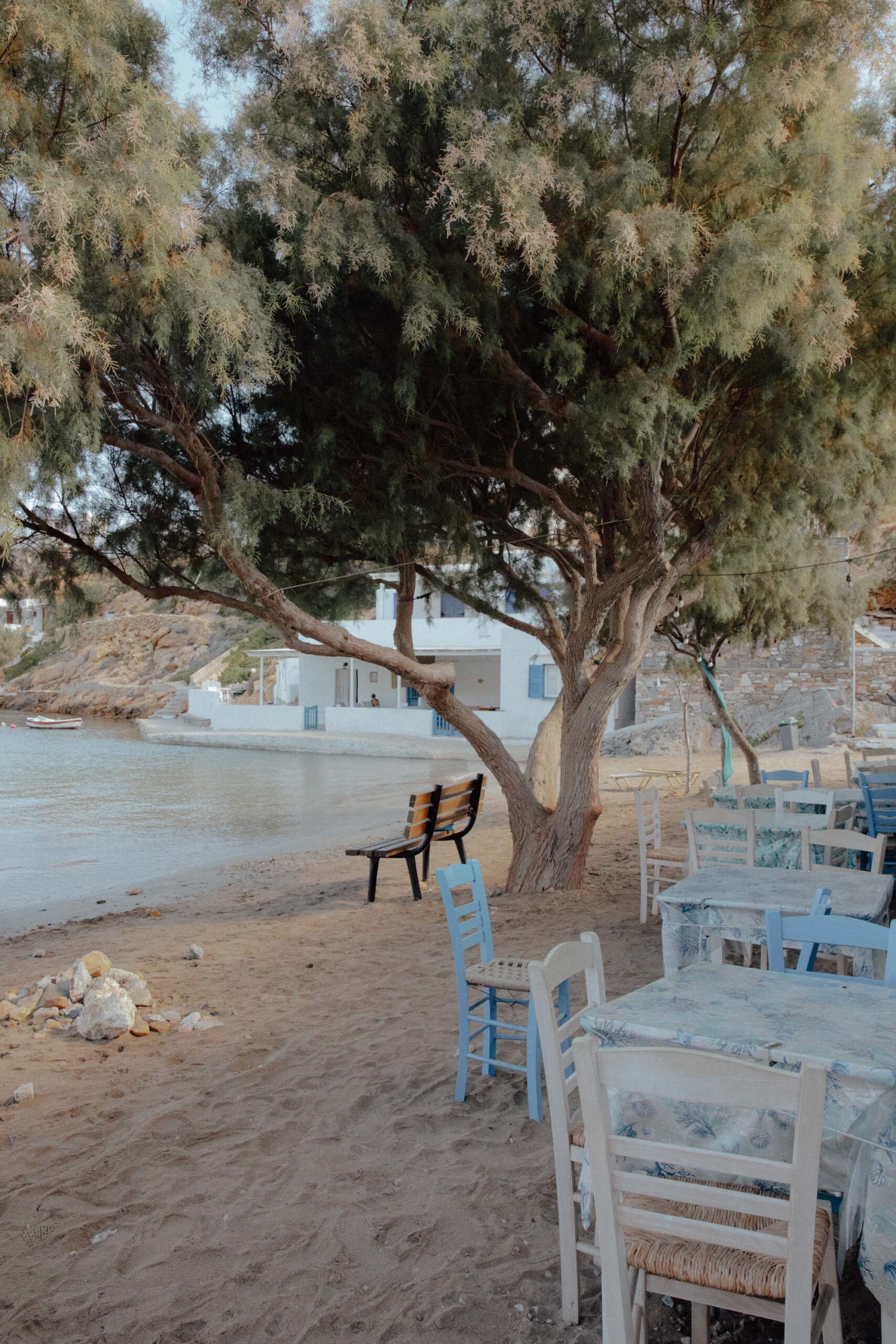 Cheronissos Beach on the north side of Sifnos, with a restaurant and chairs on the sand