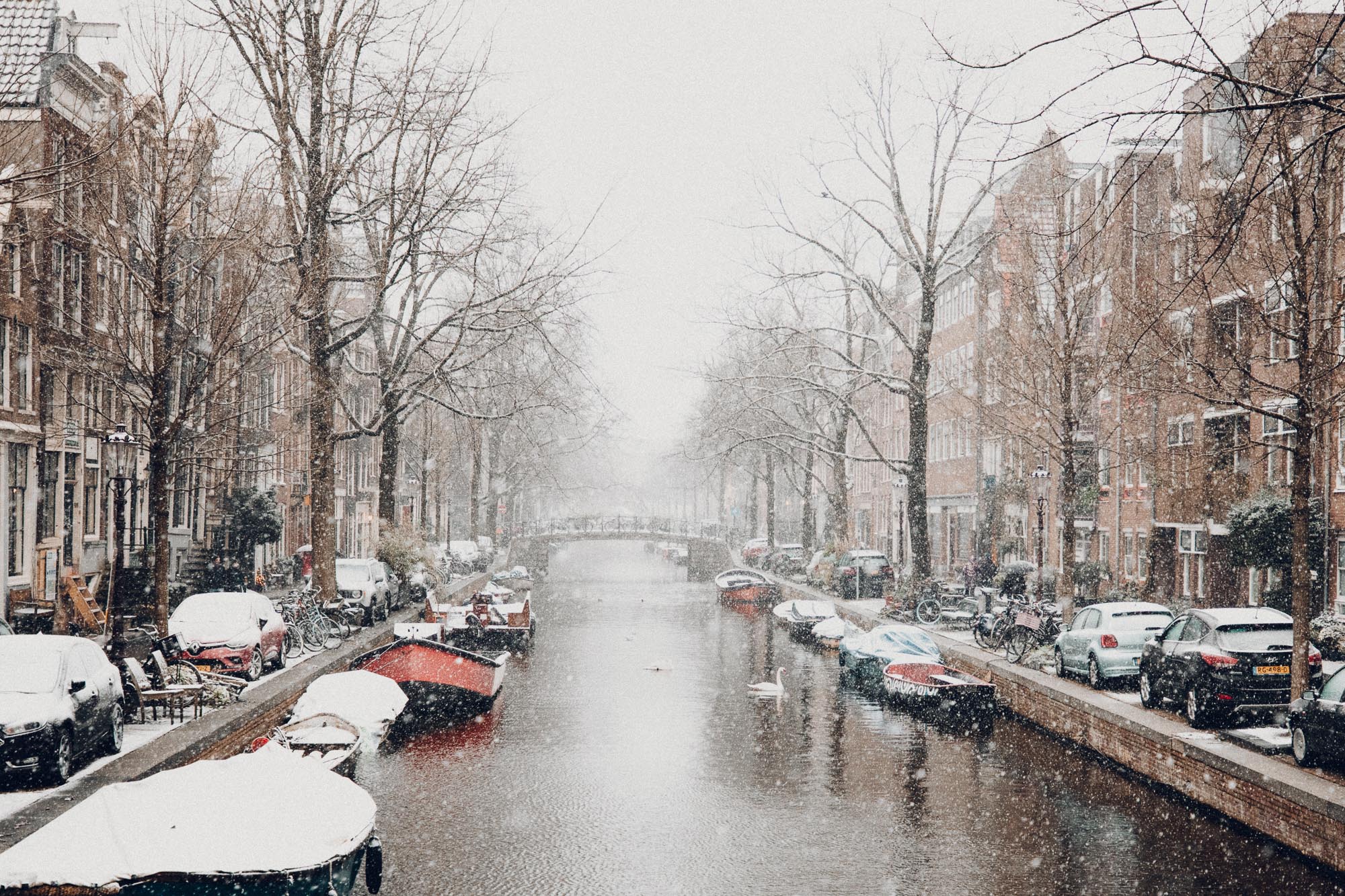 Amsterdam canals in winter with snow