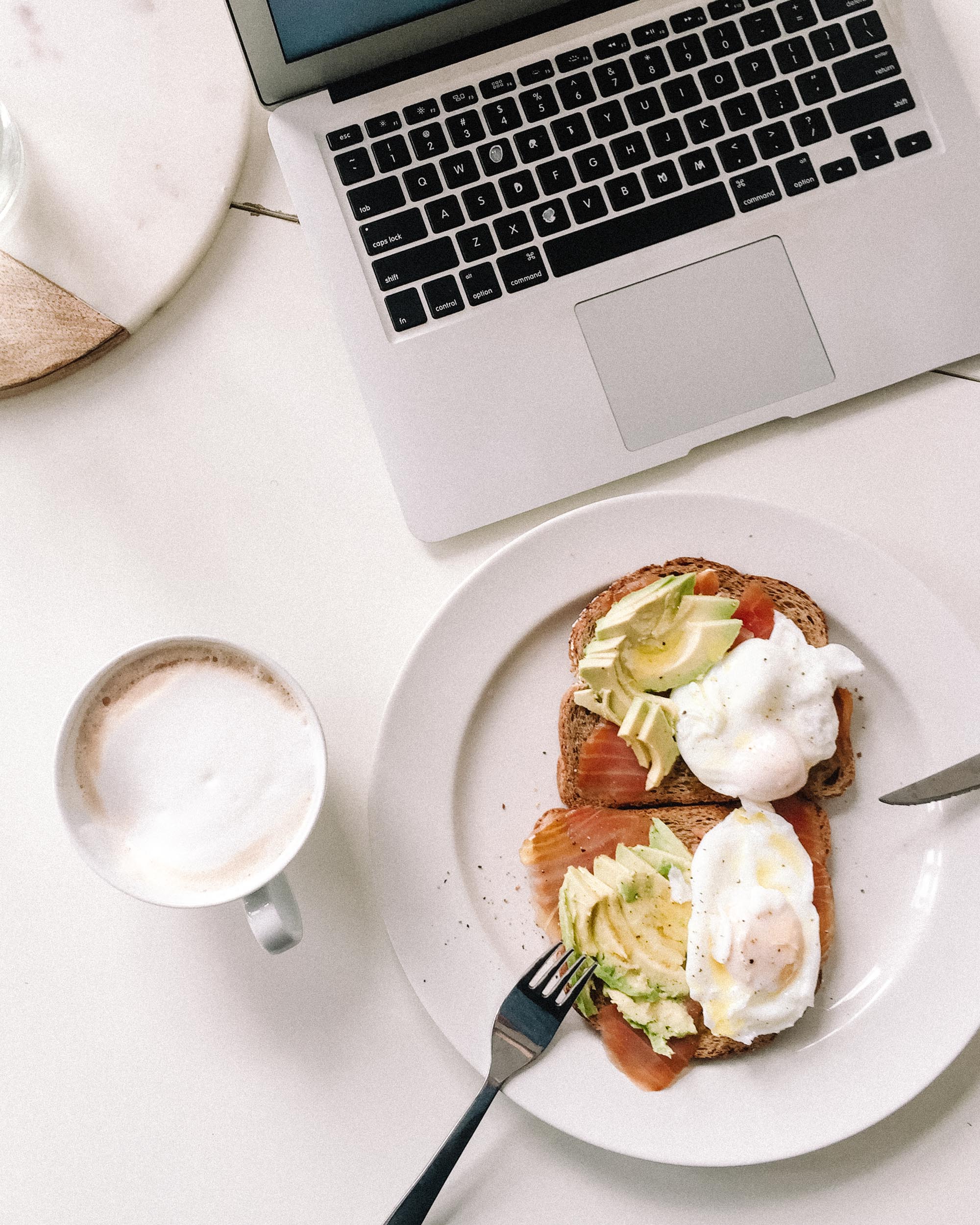 Breakfast while working from home with laptop